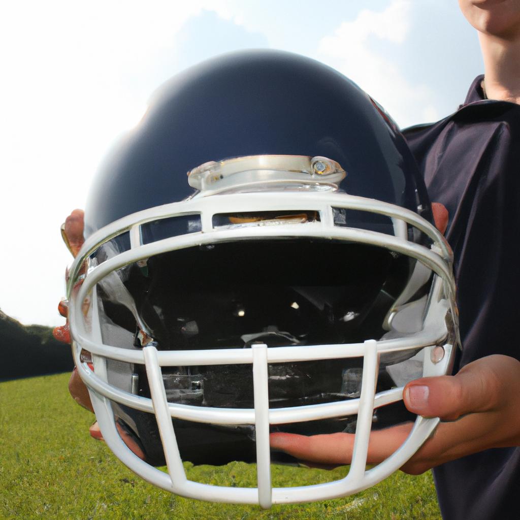 Man holding a football helmet